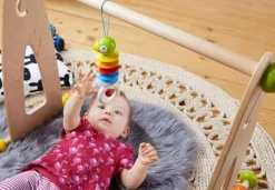 HABA Dangling Figure Parrot Stroller & Crib Toy< Hanging Baby Toys + Mobiles