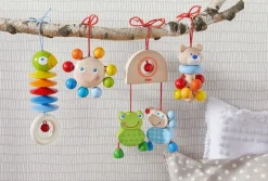 HABA Dangling Figure Parrot Stroller & Crib Toy< Hanging Baby Toys + Mobiles